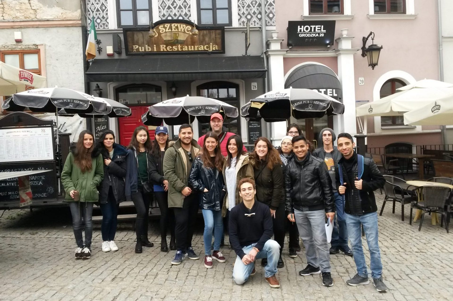 Group of guests gathered in front of the meeting point Pub U Szewca for the Lublin Free Walking Tour.